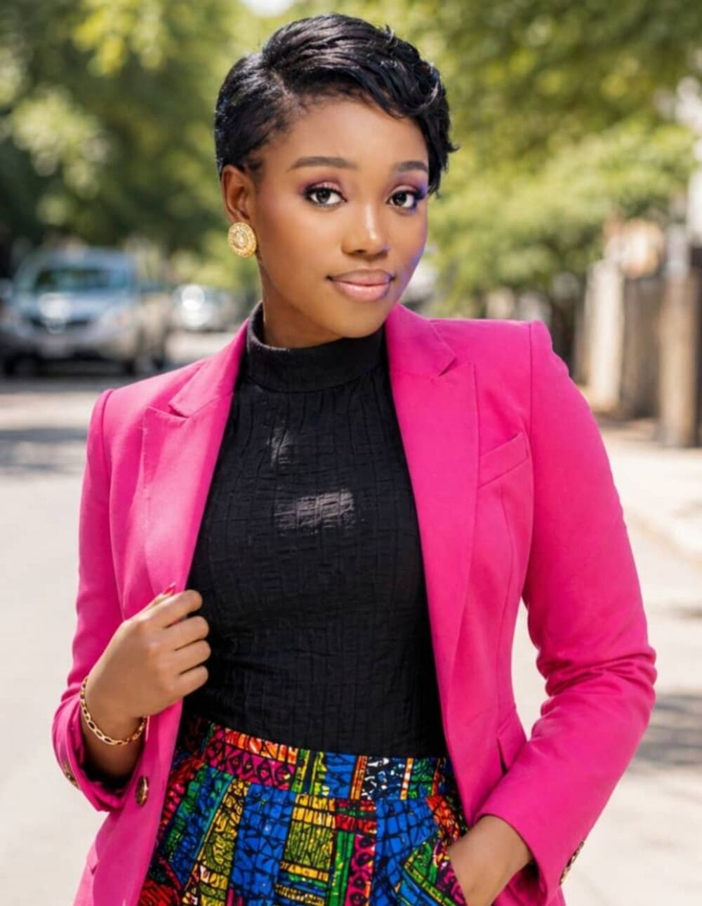 Jennifer Collins wearing a pink blazer